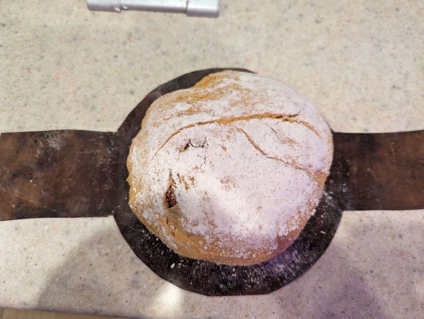 Learn how to make a bread sling for a loaf of bread sitting on a counter.